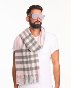 Gift-wrapped cashmere scarf next to a handwritten Valentine’s card