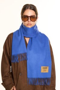 A luxurious display of soft pastel and neutral-toned Scottish cashmere scarves elegantly arranged as Mother’s Day gifts.