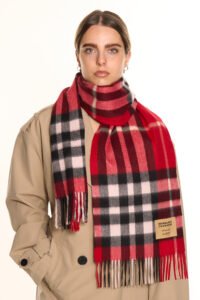 Neutral-toned cashmere scarves arranged in a luxury boutique setting