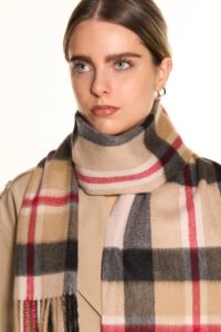 A young woman and her mother both wearing Lucchi Italy scarves, showcasing timeless fashion across generations.