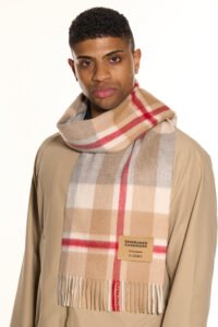 A folded tartan cashmere scarf in a signature Scottish gift box.