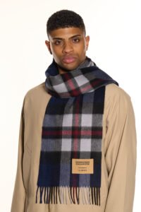 A beige cashmere scarf elegantly displayed in a premium gift box.